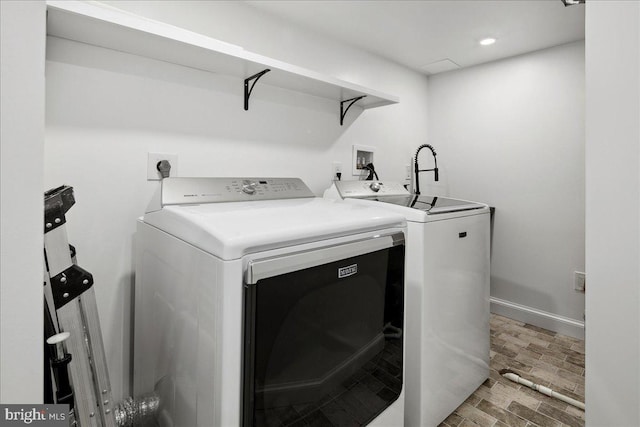 washroom featuring washer and dryer