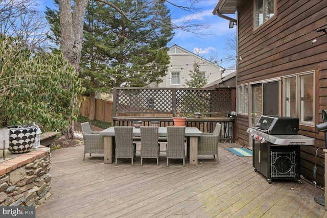 wooden deck with area for grilling