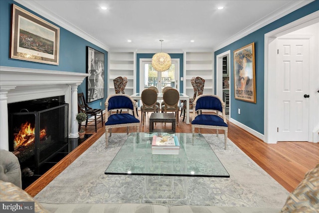 living room featuring built in features, dark wood-type flooring, and ornamental molding