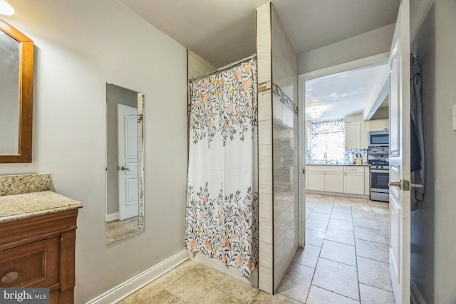 bathroom with vanity and tile patterned flooring