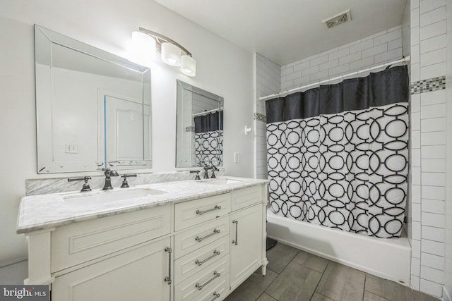 bathroom featuring vanity and shower / bath combo with shower curtain