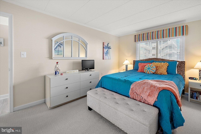 carpeted bedroom featuring ornamental molding