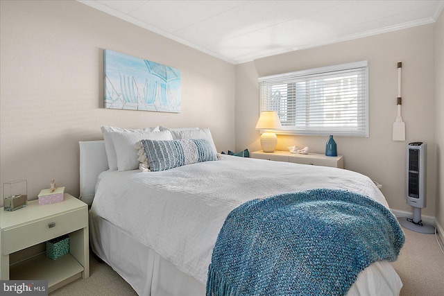 bedroom with ornamental molding and carpet flooring