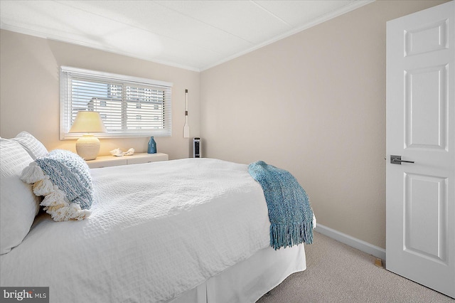 carpeted bedroom featuring ornamental molding