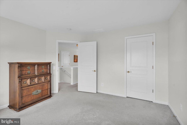 unfurnished bedroom with light carpet