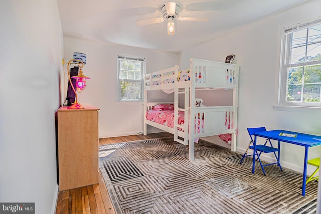 bedroom with hardwood / wood-style flooring