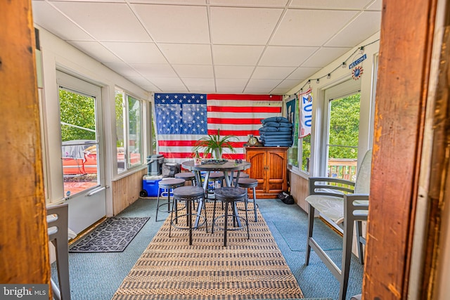 sunroom / solarium with a drop ceiling