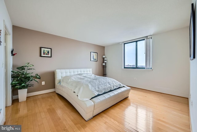 bedroom with light wood-type flooring