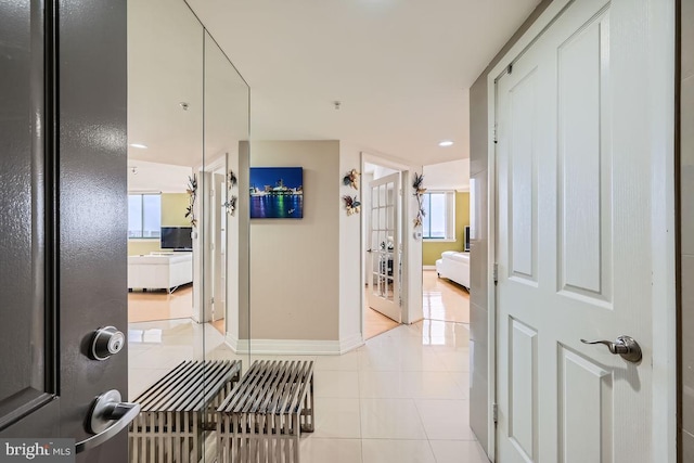 hallway featuring light tile patterned floors