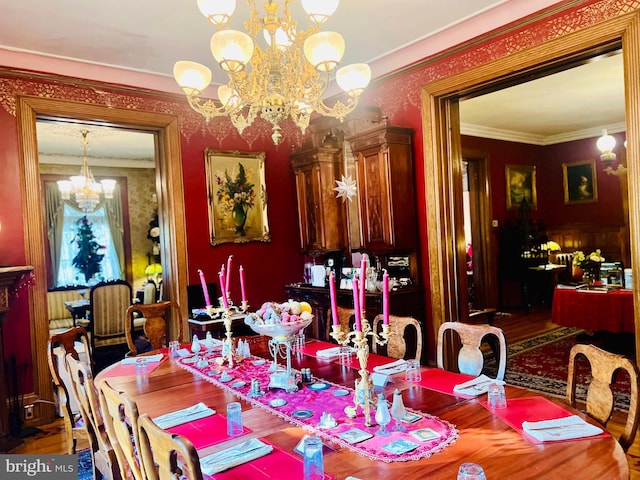 dining room with crown molding and a chandelier