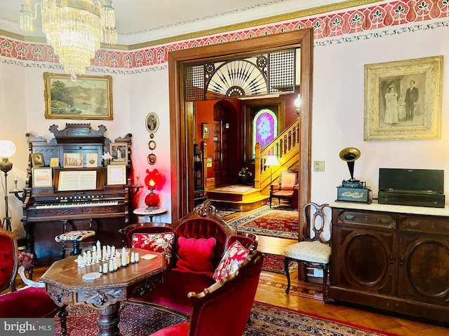 living area with separate washer and dryer, parquet floors, and a chandelier