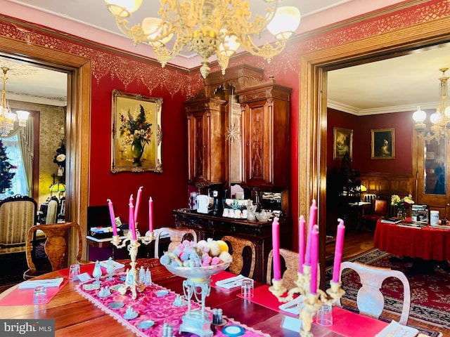 dining area featuring ornamental molding and a chandelier