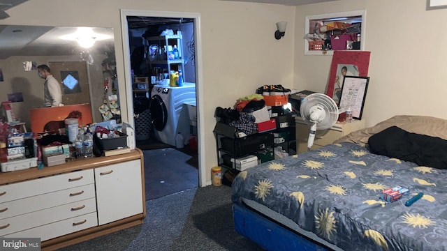 carpeted bedroom featuring washer and clothes dryer