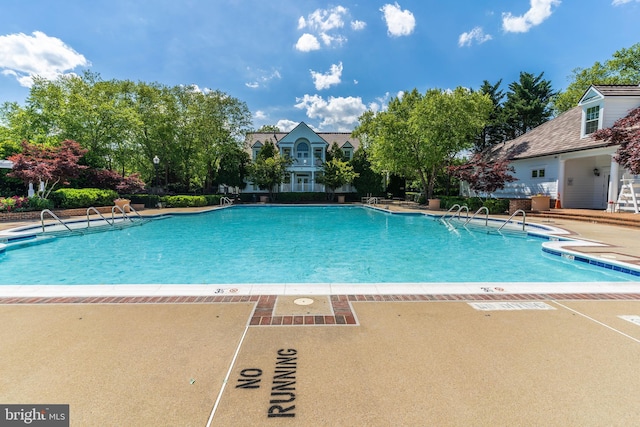 pool featuring a patio area