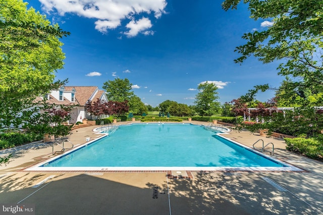 community pool with a patio