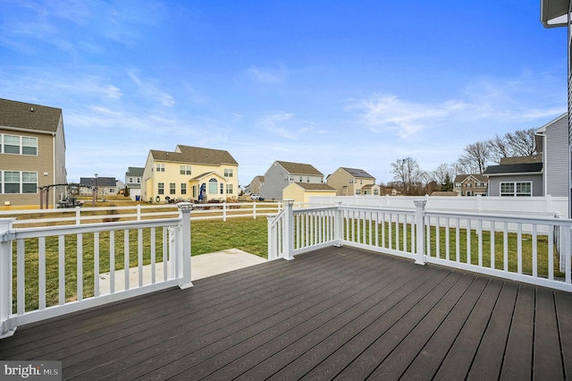 wooden terrace with a yard