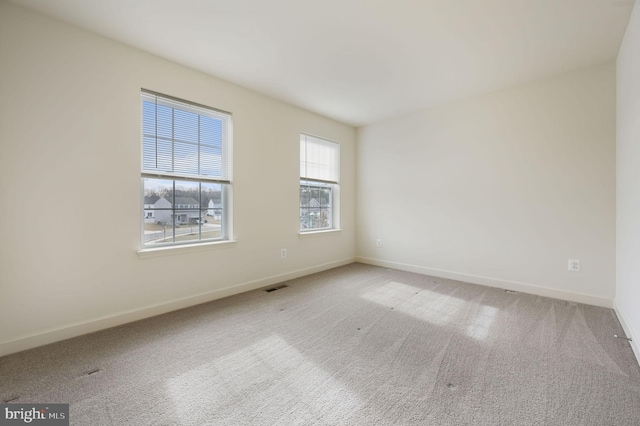 unfurnished room with carpet