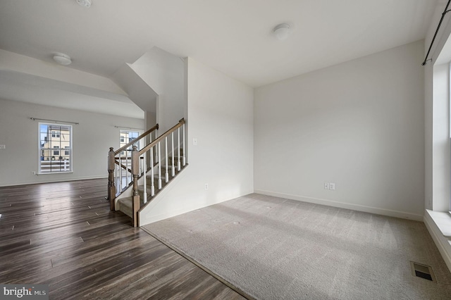 empty room featuring dark hardwood / wood-style flooring