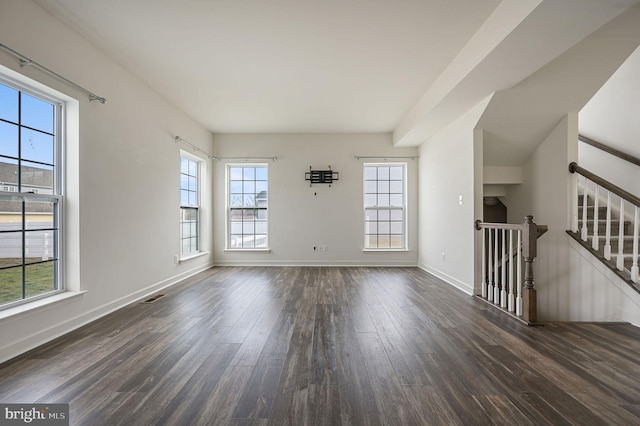 spare room featuring dark wood-type flooring