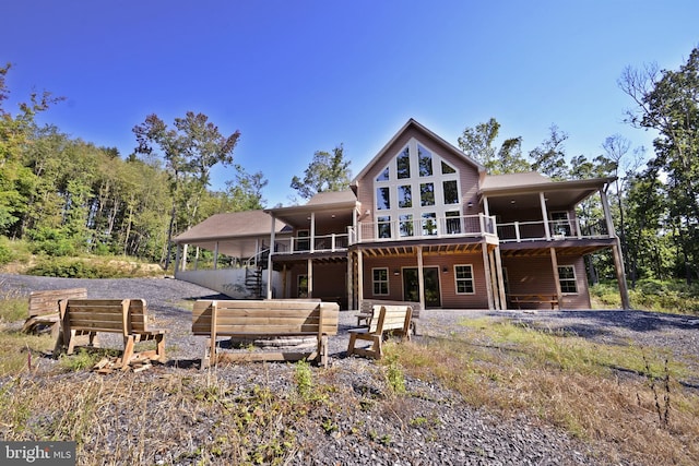 back of house featuring a deck