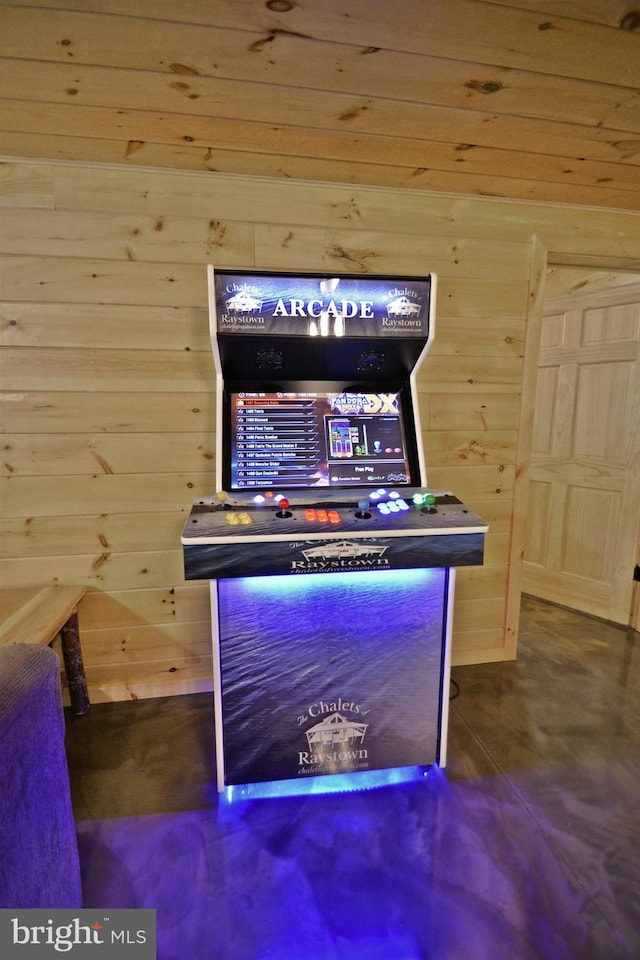 bar featuring concrete floors and wood walls