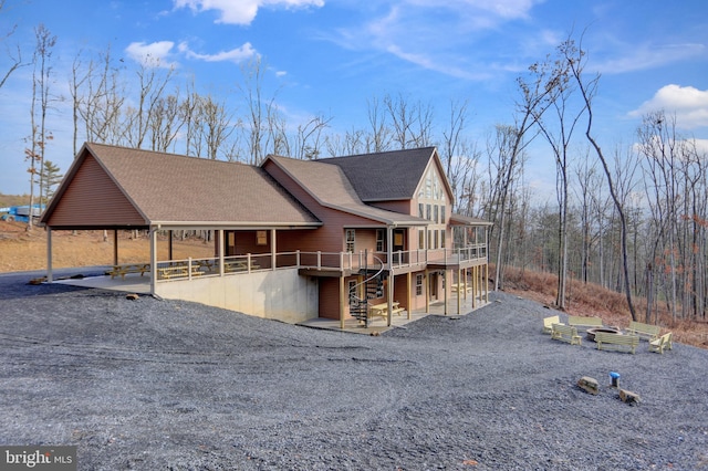 view of front of home with a patio area and a deck