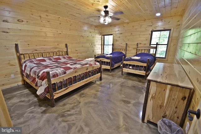 bedroom with ceiling fan, wooden ceiling, and wooden walls