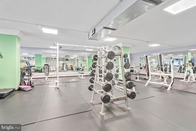 workout area with a textured ceiling