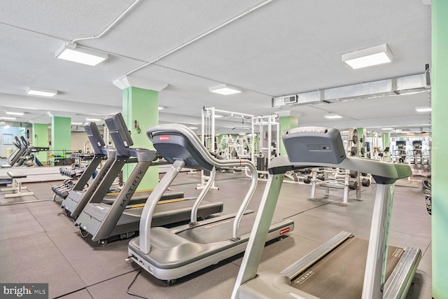 workout area featuring a textured ceiling