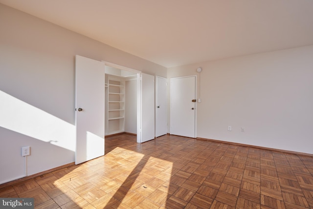 empty room featuring parquet flooring