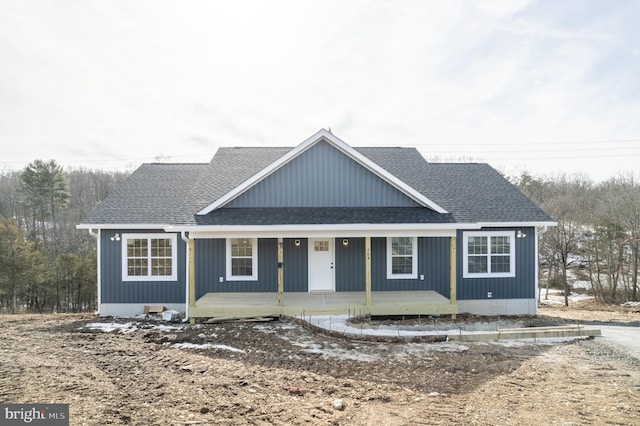 view of front of house featuring a porch and roof with shingles