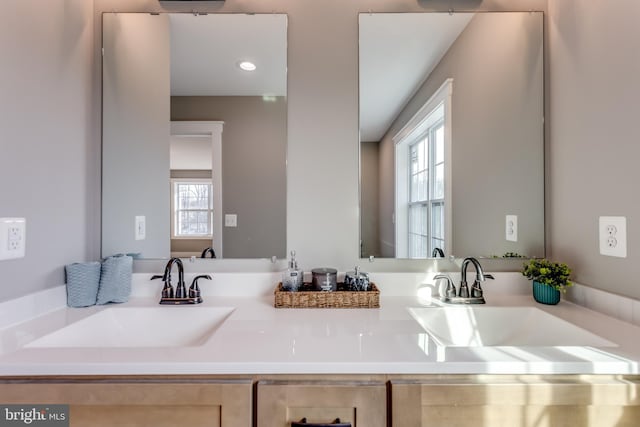 bathroom with vanity and a wealth of natural light