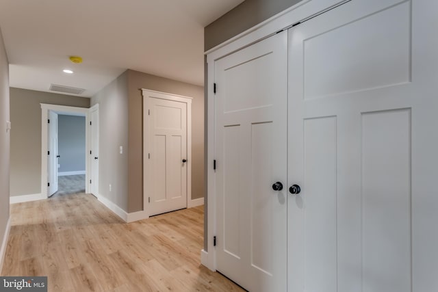 hallway featuring light hardwood / wood-style flooring