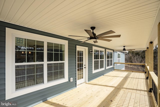 wooden deck featuring ceiling fan