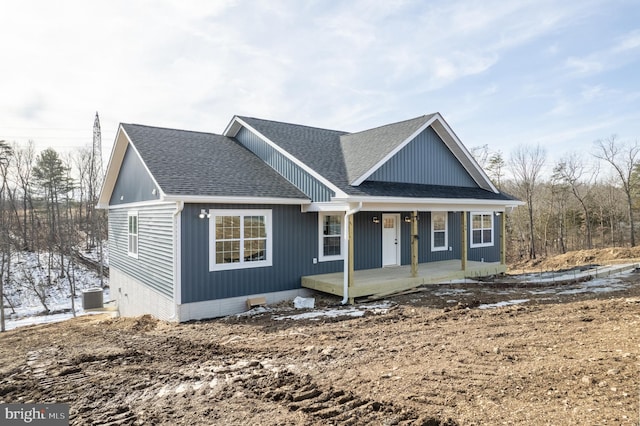 view of front of property with central AC unit and covered porch