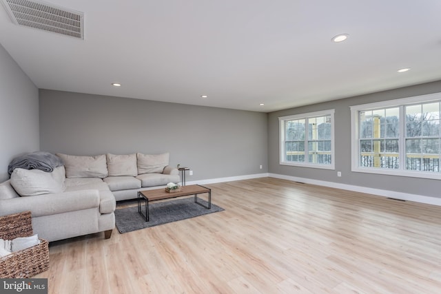 living room with light hardwood / wood-style floors