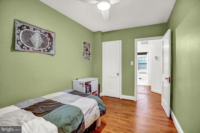 bedroom featuring light hardwood / wood-style flooring and ceiling fan