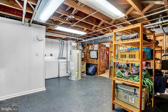 basement featuring washer and dryer and gas water heater