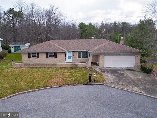 ranch-style home with a garage and a front lawn