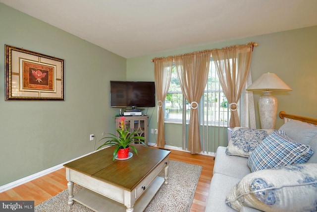 living room featuring light wood-style floors and baseboards