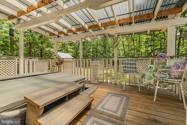 deck featuring a pergola and outdoor dining space