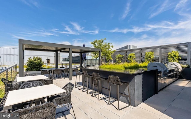 view of patio / terrace featuring an outdoor bar