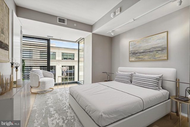 bedroom featuring expansive windows