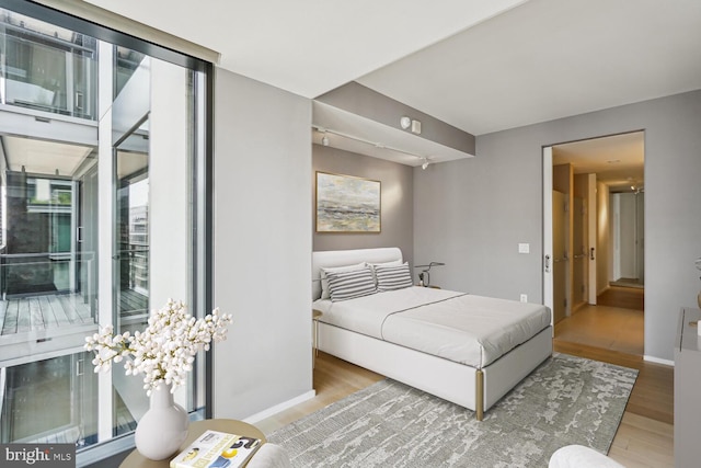 bedroom with wood-type flooring