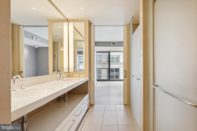 bathroom with tile patterned floors and vanity