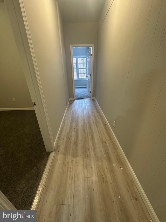 hall with light hardwood / wood-style floors