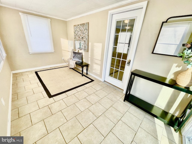 entryway featuring ornamental molding and light tile patterned floors