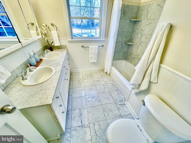 full bathroom featuring vanity, toilet, and shower / bath combo with shower curtain