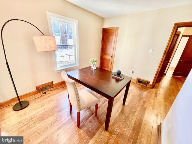 dining space featuring light hardwood / wood-style floors