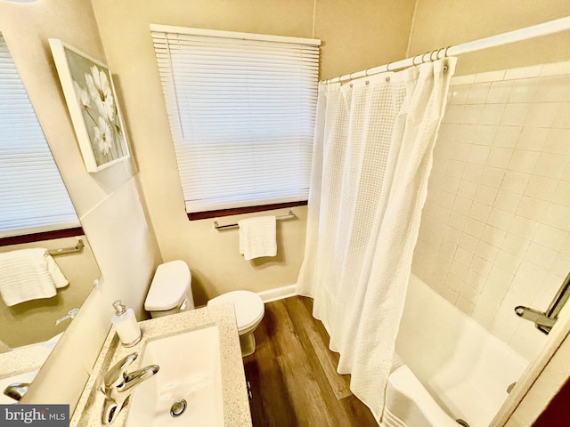 full bathroom with wood-type flooring, sink, shower / bath combo, and toilet